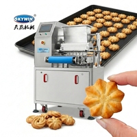 Machine automatique compacte de fabrication de biscuits et de gâteaux moelleux de type plateau