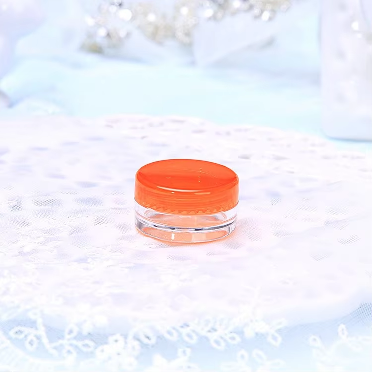 clear jar with orange cap