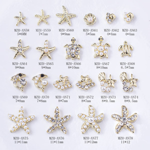 จี้ตกแต่งเล็บ 3 มิติ รูปทรงแบน สีทอง ทำจากโลหะผสม รูปปลาโลมา ปลาดาว เต่า เปลือกหอย น่ารัก สไตล์ฤดูร้อน ประดับด้วยเพชรพลอย - Product Image 1