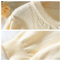 Automne hiver élégant couleur unie au crochet évider tricot femmes Cardigan décontracté simple boutonnage tricoté dame pull manteau