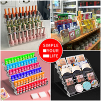 Présentoirs de comptoir de parfum acrylique transparents élevés présentoir acrylique trapézoïdal multicouche de bureau
