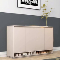 Un meuble à chaussures en bois blanc et gris, élégant et simple, utilisé pour l'entrée, avec une porte et des compartiments cachés