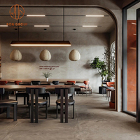 Meubles de salle à manger modernes pour café, table ronde en bois avec chaises à structure métallique et coussins de siège beiges pour restaurant