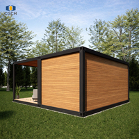 Maison modulaire préfabriquée en conteneur avec terrasse, panneau mural en bois grainé à cadre noir CGCH