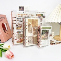 Protège-cahier A5 scintillant en PVC souple transparent avec 6 anneaux ronds or rose et fermeture à bouton-pression pour classeur à feuilles mobiles