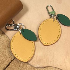 Llaveros de cuero PU con diseño de limón, elegantes y portátiles, bonitos colgantes de frutas para bolso, mosquetones promocionales, adornos para bolso - Product Image 1