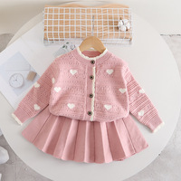 Ensemble de vêtements d'automne et d'hiver pour filles jupe tricotée pull creux en forme de cœur ensemble deux pièces à manches longues vêtements pour enfants