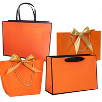Cadeau de vente au détail de vêtements personnalisés sacs en papier kraft brun bon marché avec poignée de logo de marque utilisation promotionnelle