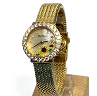 Montre-bracelet de luxe pour femme avec bracelet en maille plaqué or, lunette sertie de diamants, cadran en nacre et motif tournesol