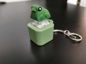 Nueva tendencia recargable Croak Frog colgante llavero sonido luz funciones personalizadas plástico Keycaps juguetes Axis Tester llavero - Product Image 6