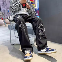 Jeans noirs personnalisés pour hommes en coton denim, patchwork étoilé, déchirés, coupe ample et droite pour un style décontracté et streetwear