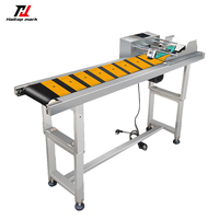 Alimentateur à friction industriel pour feuilles de carton, synchronisé avec l'imprimante CIJ pour l'impression de numéros de lot