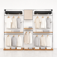 Présentoir mural pour vêtements de vente au détail Design d'intérieur Boutique de mode Présentoir métallique pour vêtements T-shirt Étagère