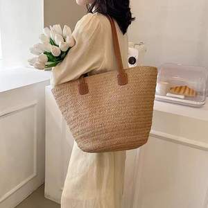 กระเป๋าหวายสานทรงตะกร้าใส่ผัก ขนาดใหญ่ รุ่นใหม่ ปี 2026 สายสะพายไหล่คู่ เปิดปิดแบบเปิด  กระเป๋าฟาง หนังแท้ สำหรับสาวๆ ไปเที่ยวทะเล - Product Image 1