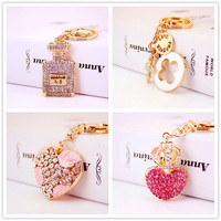Porte-clés en alliage plaqué or pour femme, petit pendentif en métal en forme de flacon de parfum, breloques trèfle à quatre feuilles, accessoires de sac