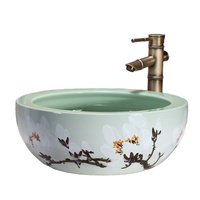 Fregaderos de baño de cerámica de flor de ciruelo redondo pintado a mano con arte sobre encimera verde esmaltado a la venta