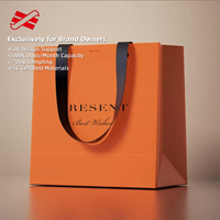 Sac de luxe au détail avec logo de marque personnalisé sac en papier d'art orangé ivoire sac à provisions cadeau en papier carton avec poignée
