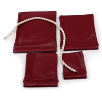 Sac de rangement en cuir PU étanche avec fermeture automatique Conception d'éclats d'obus simples pour cosmétiques Bijoux Pochette de rangement pratique