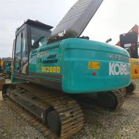Excavatrice hydraulique sur chenilles d'occasion de 20 tonnes, de fabrication japonaise, Kobelco SK200D, pour démolition et travaux de renforcement.