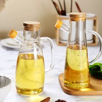 Pot minyak kaca tahan bocor borosilikat tinggi dengan pegangan dan tutup bambu untuk peralatan dapur Dispenser kaca minyak zaitun