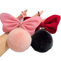 Vente en gros de porte-clés en peluche douce et moelleuse avec un grand nœud en fourrure, pompon en peluche, dessin animé d'Halloween, pendentif de sac, cœur