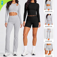 Ensemble de yoga athlétique 2 pièces taille haute séchage rapide uni avec crop top à manches longues et découpes aux épaules et short legging pour la gym et la course