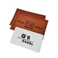 Großhandel Bekleidungszubehör Private Label Logo PU Echtleder-Etikett Jeans Blanko-Kleidungsetikett Geprägter Individueller Leder-Patch