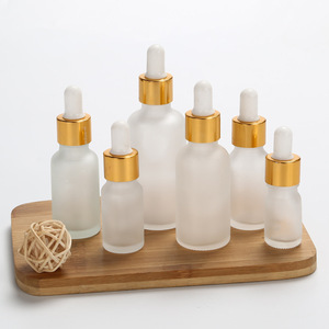 Frascos cuentagotas redondos de vidrio esmerilado dorado de 5ml-100ml con tapa de rosca de color y serigrafía, personalizables con marca para suero de cuidado de la piel - Product Image 6