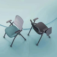 Chaise d'école rembourrée en tissu chaise de formation tablette d'écriture chaise de tablette de conférence empilable en gros fer pliable moderne
