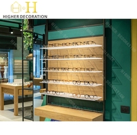 Vitrine de présentation de lunettes de style industriel vert foncé pour magasin d'optique, comptoir en verre, meuble de présentation pour lunettes