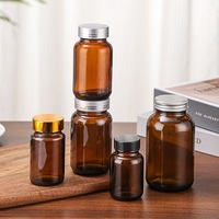 Bouteille en verre ronde à large ouverture de 60 ml, 75 ml, 100 ml, 120 ml, 150 ml, 200 ml, 400 ml, 500 ml avec bouchon à vis ambré pour le stockage de pilules pharmaceutiques