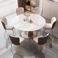 Table à manger en marbre blanc avec piétement sculptural doré pour restaurant, hôtel, café, bistrot, salle à manger