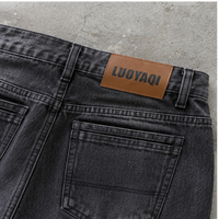 Jeans en denim pour hommes, coupe décontractée, jambe large, déchirés, cloutés, effet délavé vintage noir, imprimé graphique streetwear, personnalisés, style urbain, vente en gros