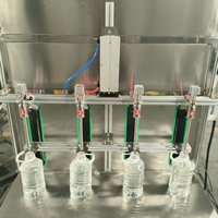 Machine de remplissage de liquides semi-automatique à 4 têtes, à alimentation par gravité, pour spiritueux, liqueurs, alcool, vin