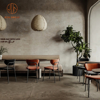 Meubles de salle à manger modernes pour café, table ronde en bois avec chaises à structure métallique et coussins de siège beiges pour restaurant