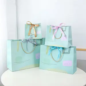 Emballage de cadeau blanc de luxe avec logo personnalisé kraft brun, sac à provisions en papier avec poignées en corde de nylon torsadé/