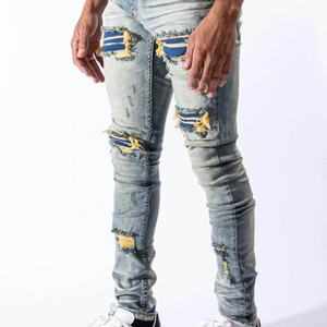 กางเกงยีนส์เดนิมทรงสกินนี่สีน้ำเงินแบบวินเทจ ดีไซน์เนอร์คุณภาพสูง ขายส่ง แบบสั่งทำพิเศษ ขาดเซอร์ๆ แต่งผ้าปะติดปะต่อ สำหรับผู้ชาย - Product Image 3