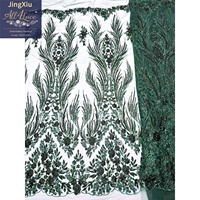 Tissu en dentelle africaine avec broderie de sequins rouges et motifs de plumes symétriques sur maille nude pour robes de soirée – Vente en gros