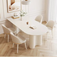 Table à manger ovale en pierre frittée blanc crème, base sur pieds double cannelés, table de salle à manger longue et moderne pour la maison et la cuisine