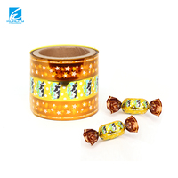 Rollo de película flexible brillante de calidad alimentaria con impresión personalizada para envolver chocolate, piruletas y caramelos duros con alta retención de torsión