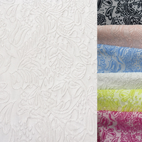 Tissu jacquard brodé floral miniature blanc et noir, matière spéciale Nais, 100 % polyester, léger, 150 g/m², pour mariage.