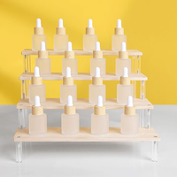 Présentoir multi-niveaux en acrylique pour magasin, organisateur de rangement de type étagère pour gâteaux et parfums