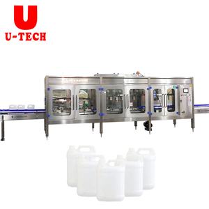 Jerrycan automatique de 5 <span class=keywords><strong>litres</strong></span> en plastique PET HDPE Momoblock Type linéaire Machine d'embouteillage de remplissage et de capsulage d'eau pure - Product Image 1