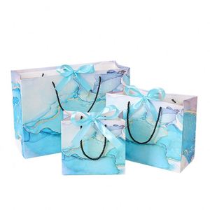 Sacs cadeaux de luxe en papier imprimé marbre, sacs de transport portables en gros avec nœud pour crèmes de soin et cadeaux de mariage - Product Image 1