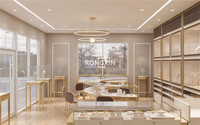 Aménagement intérieur sur mesure pour bijouterie, présentoirs et menuiseries personnalisés pour bijoux, vitrine en métal doré et verre pour boutique de détail