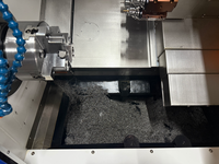TCK-52MYC Twin Spindle 3-Axis CNC Turning Center dengan Kapasitas Batang 52mm untuk Bagian Logam Presisi Kompleks.