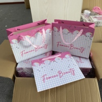 Sacs cadeaux en carton kraft de style luxueux avec logo personnalisé pour les petites entreprises avec poignée en ruban