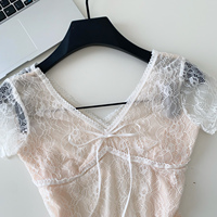 Chemisier d'été élégant pour femme à manches courtes, col en V, en dentelle, avec nœud sur le devant, coupe ample, idéal pour le bureau