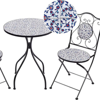 Ensemble table et chaises rustiques vintage à motifs floraux, table ronde et chaises en fer forgé bleu pour balcon ou café