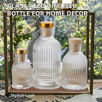 Bouteille diffuseur de parfum ronde en verre pour décoration intérieure 50ml/100ml/200ml avec bouchon en liège et impression sérigraphiée pour huile aromatique vide